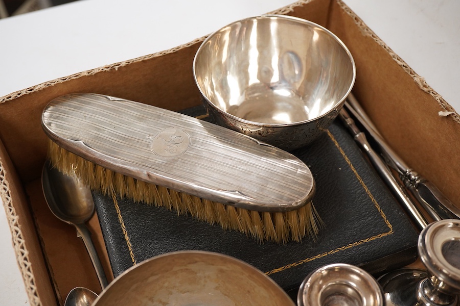 A small group of assorted silver and white metal items including a cased matched pair of Victorian silver pepperettes, an Edwardian silver five bar toastrack, a pair of late Victorian silver salts by William Hutton & Son